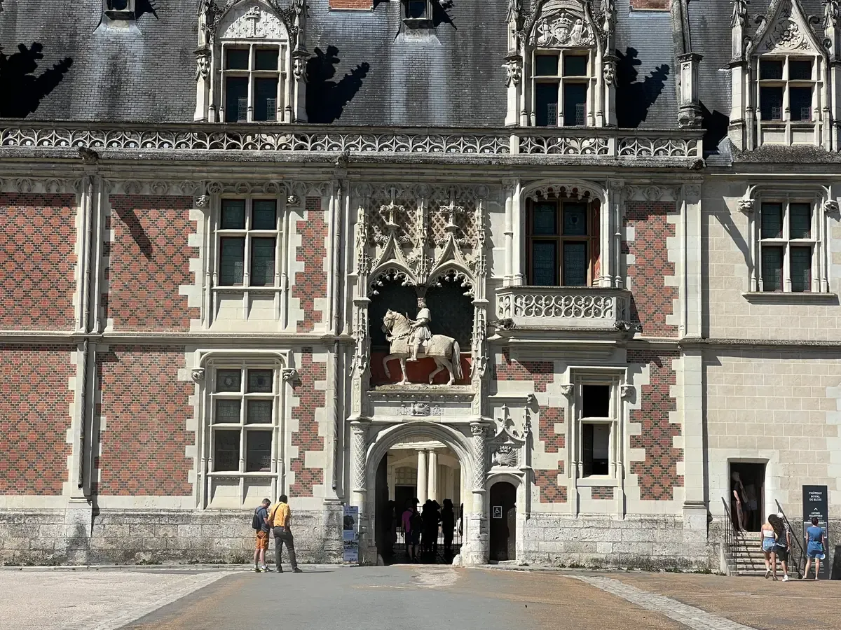 Louis XII wing entrance of the Château de Blois on a Loire Valley castles tour